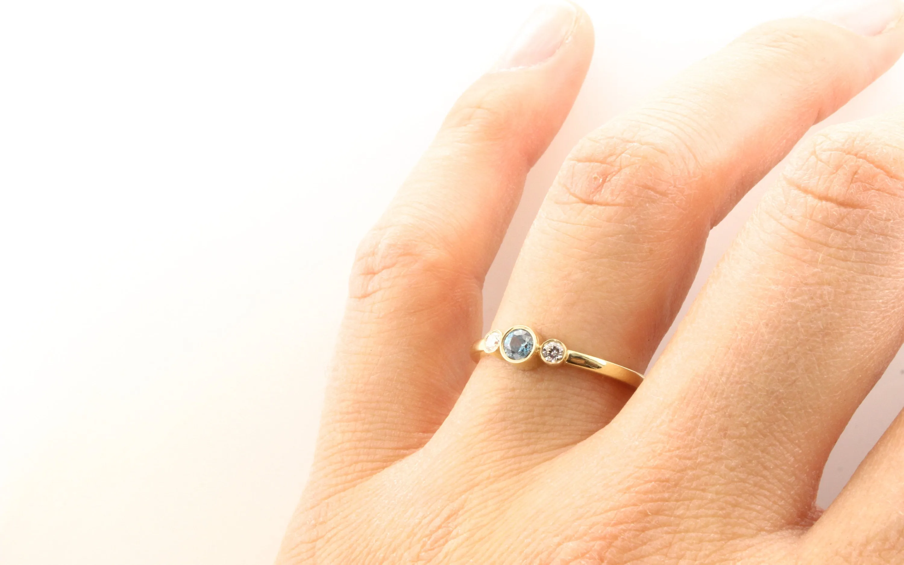 14K Gold Blue Zircon & Diamond Bezel Ring