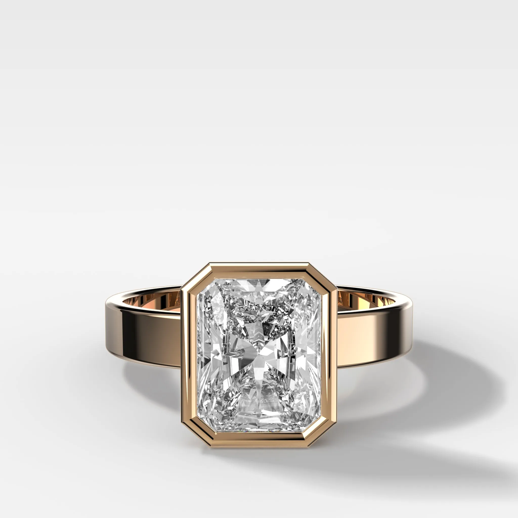 Finest Bezel Set Engagement Ring With Elongated Radiant Cut Diamond