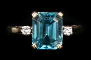 Modern 14K Yellow Gold 5 CT Emerald Cut Blue Zircon and Diamond Ring