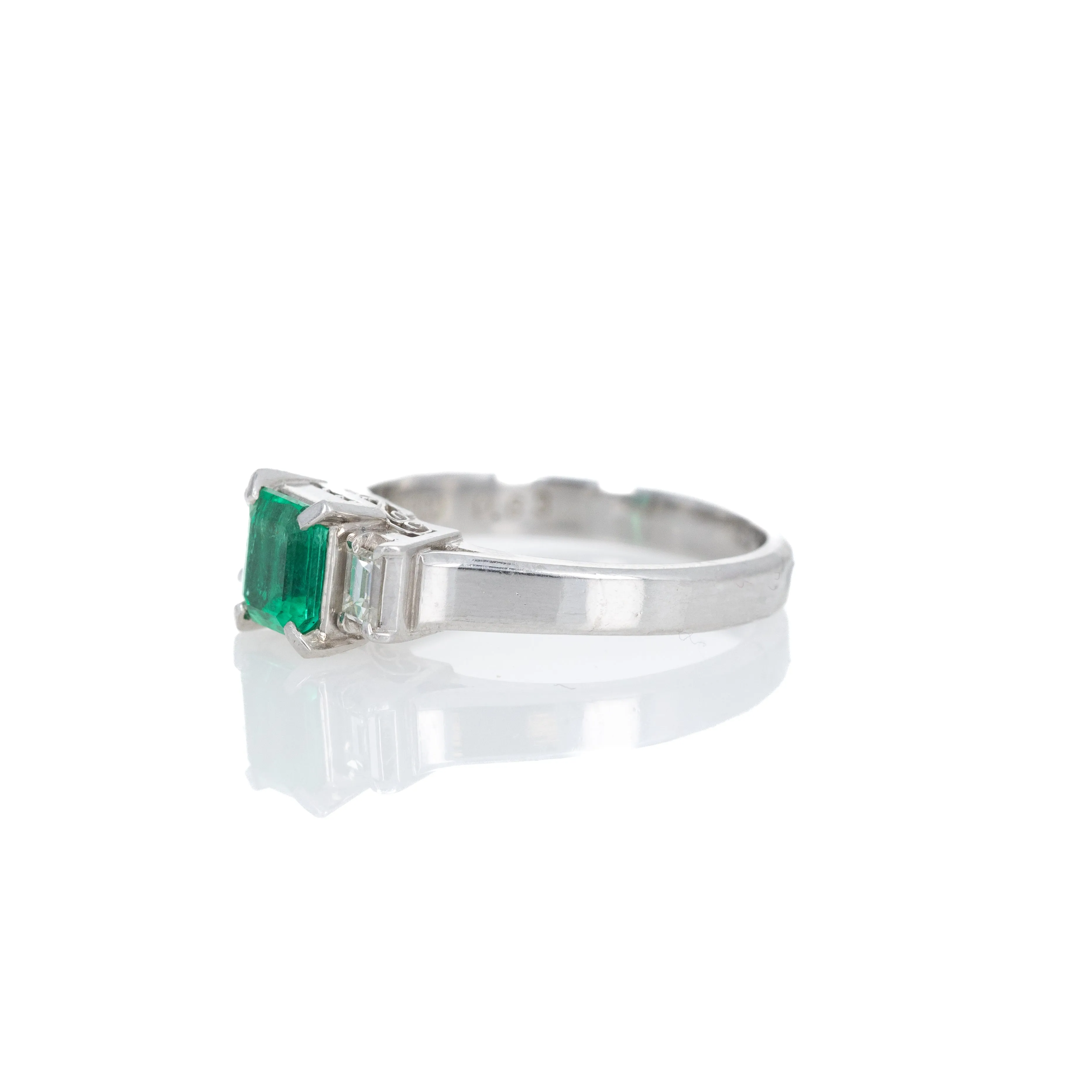 Platinum 0.63 Carat Emerald Diamond Three Stone Ring