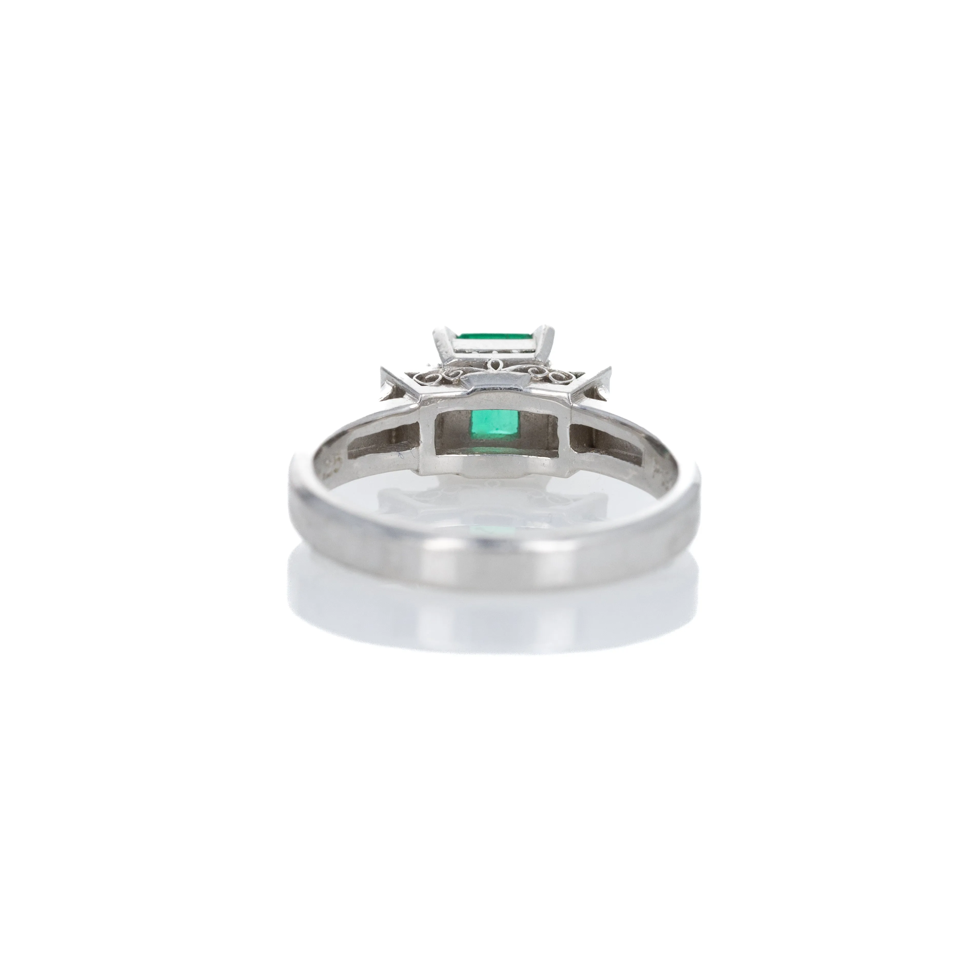 Platinum 0.63 Carat Emerald Diamond Three Stone Ring