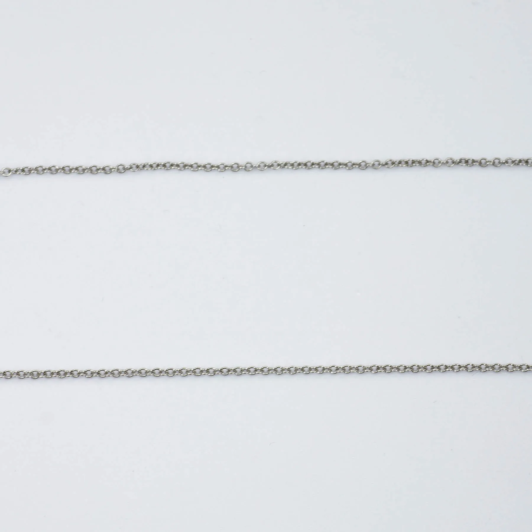 'Tiffany & Co.' Jean Schlumberger Ten Diamond Cross Pendant Necklace  | 0.35ctw |